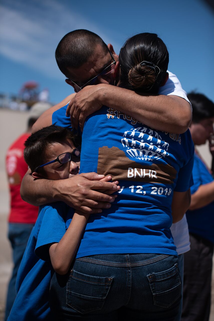People hug at the dried up Rio Grande at the "Abrazos no muros" celebrated last May. 